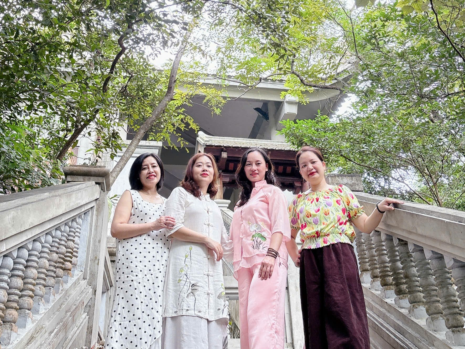A group of women standing on stairs
AI-generated content may be incorrect.