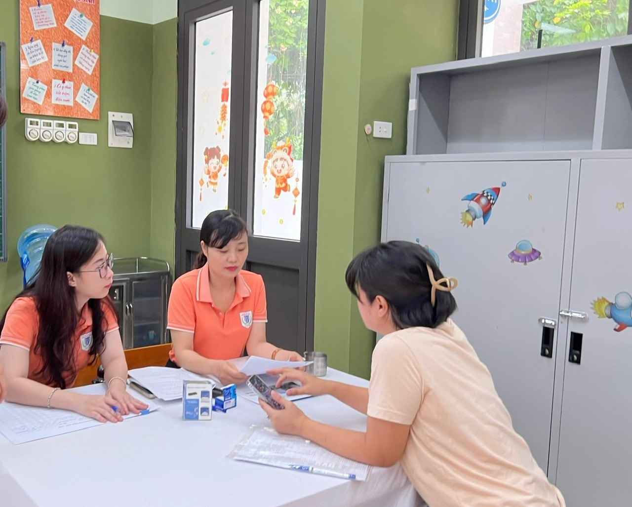 A group of women sitting at a table

Description automatically generated