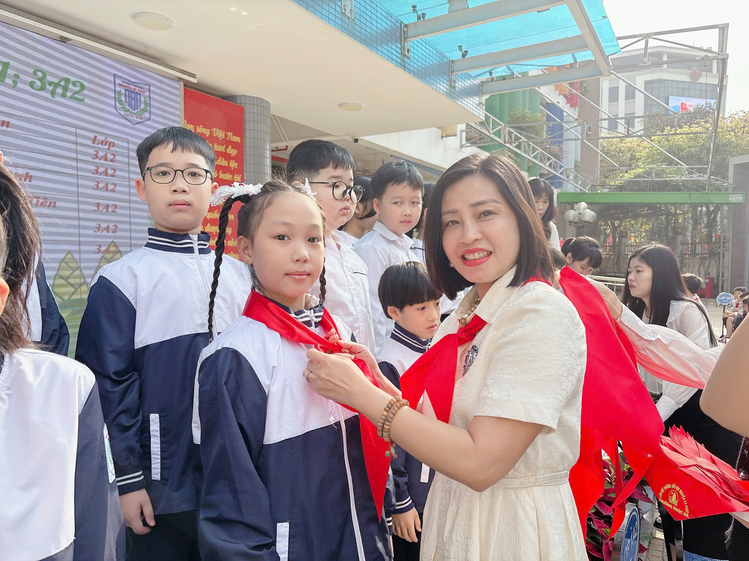 A person tying a red scarf around a group of children
AI-generated content may be incorrect.