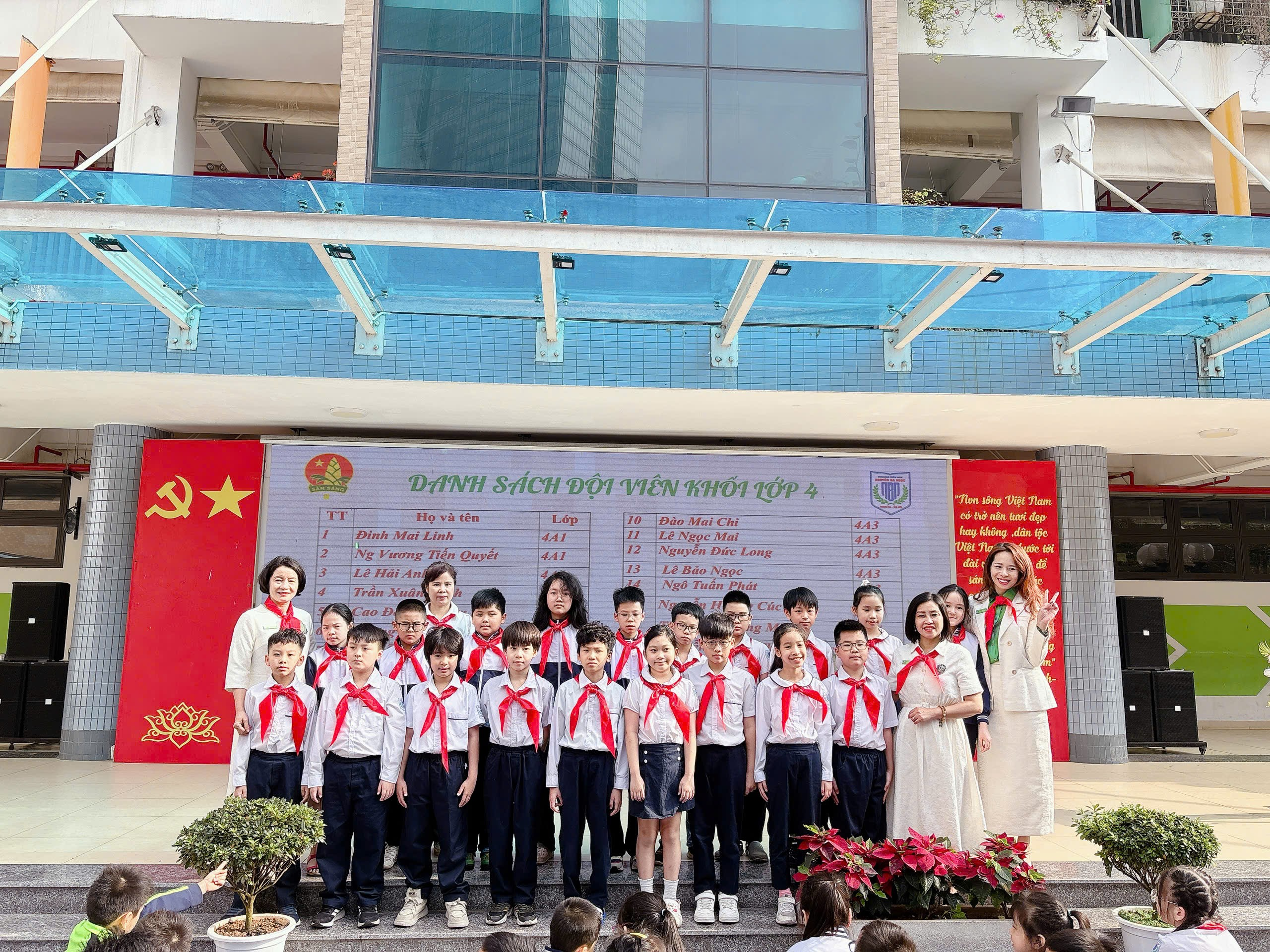 A group of people standing in front of a sign
AI-generated content may be incorrect.